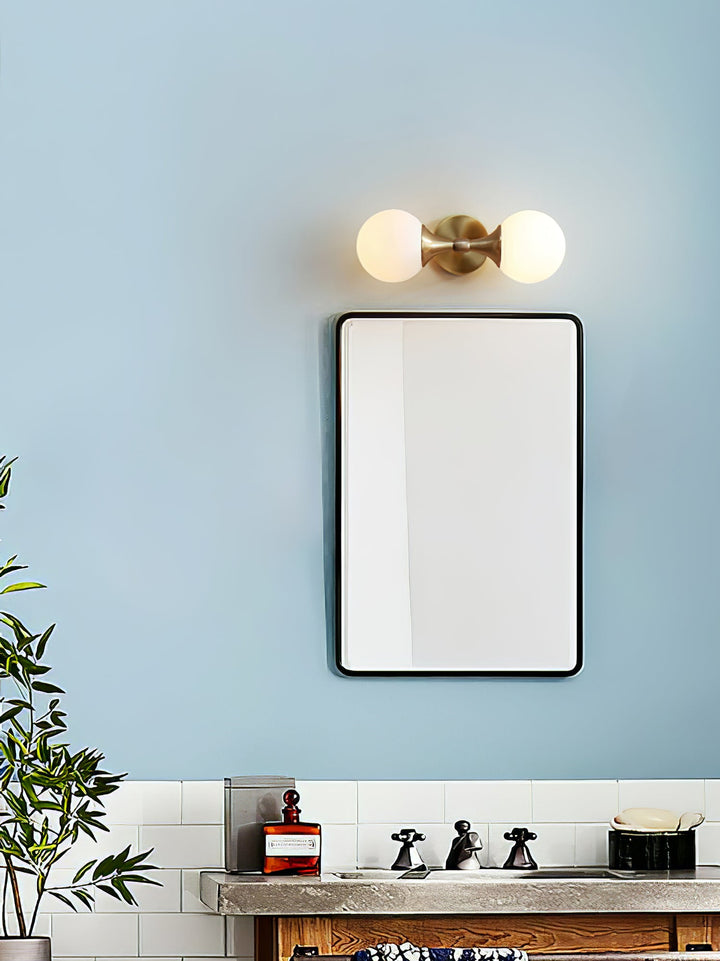 Vintage-style wall lamp made of glass and metal