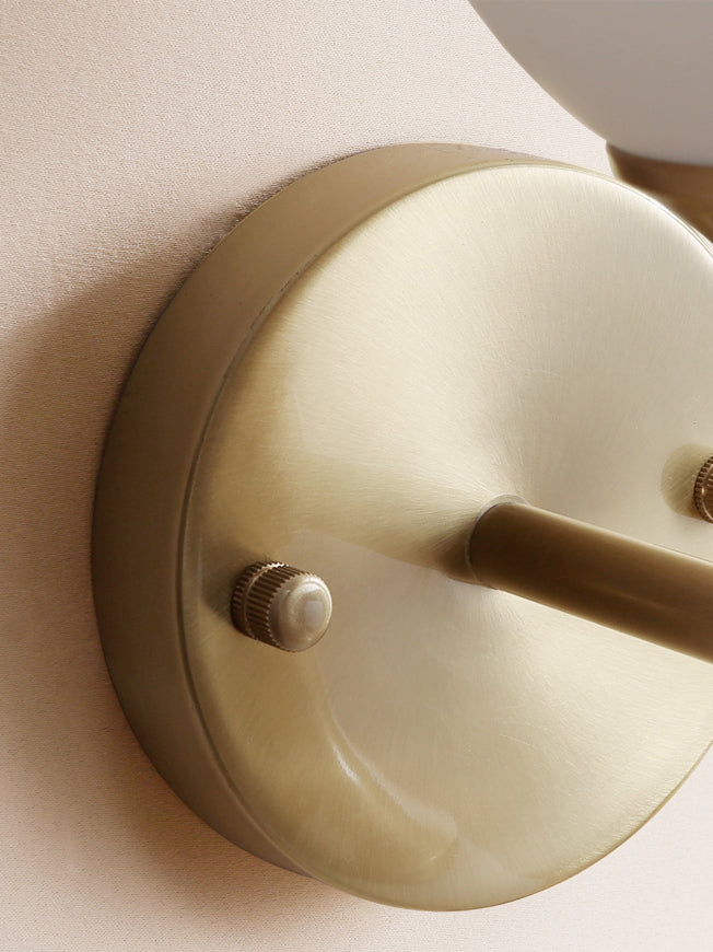 Vintage-style wall lamp made of glass and metal