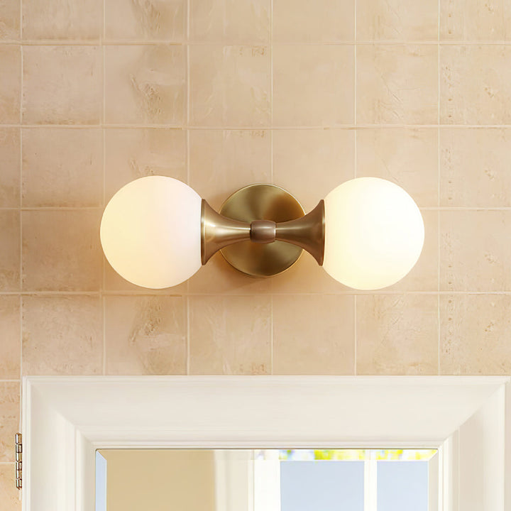 Vintage-style wall lamp made of glass and metal