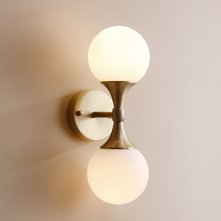Vintage-style wall lamp made of glass and metal