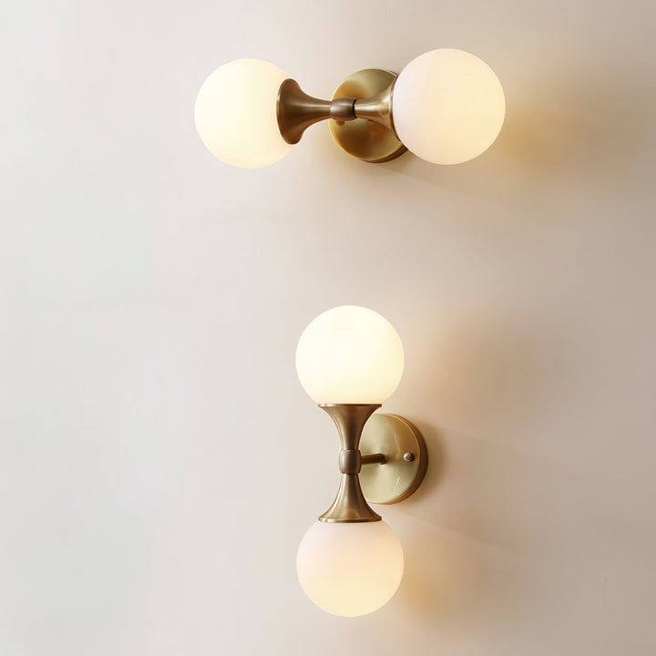 Vintage-style wall lamp made of glass and metal