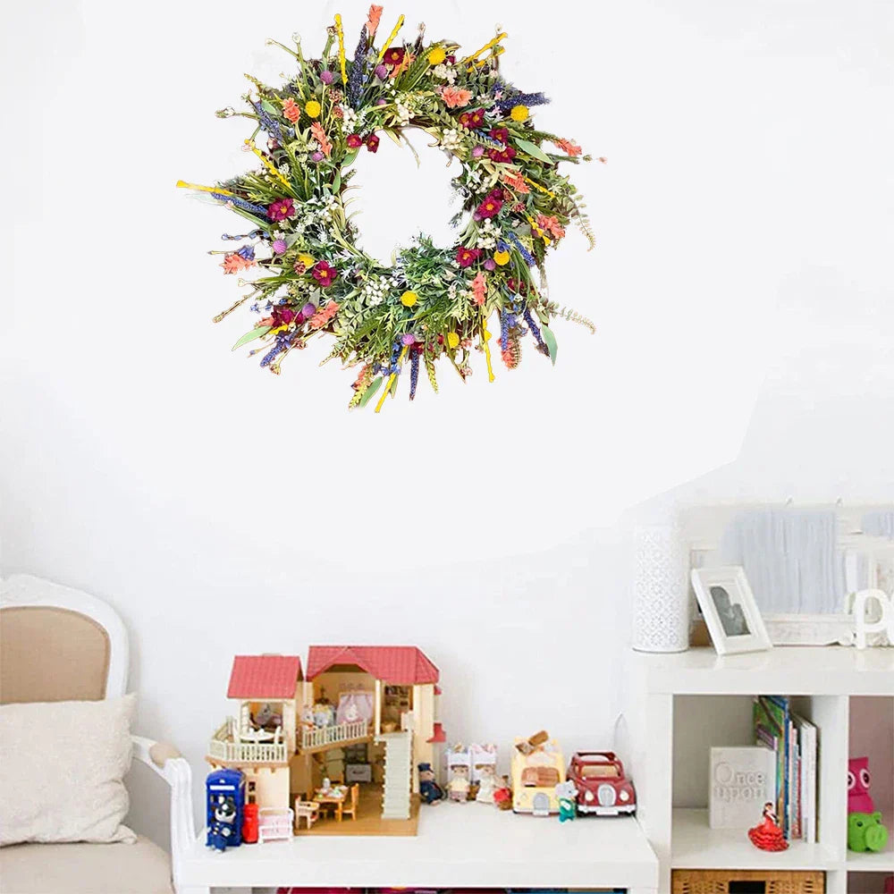 Handmade wreath with colorful artificial flowers 