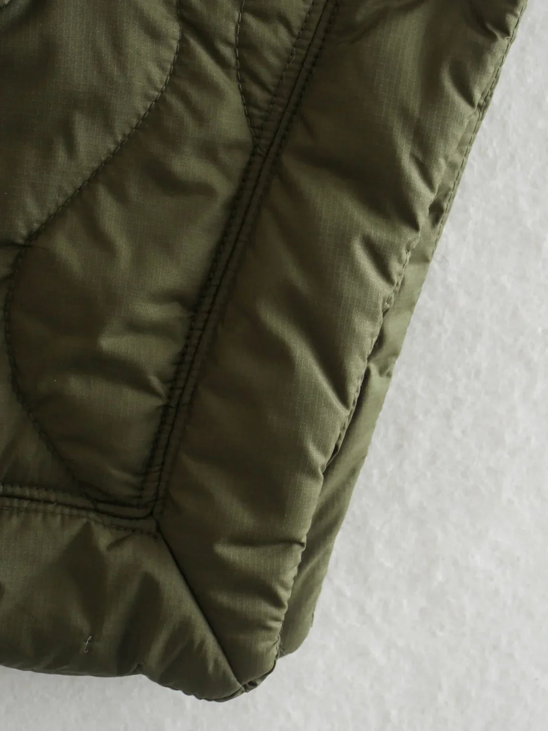 Women's quilted coat in oversized design with stand-up collar 