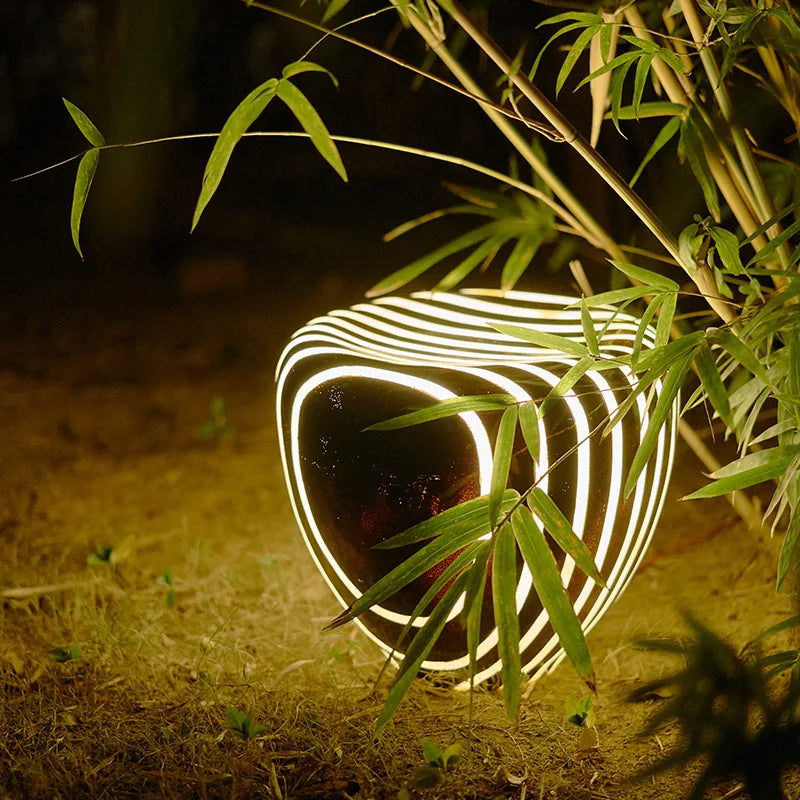 Modern weatherproof solar garden light in a stone-look design for stylish outdoor areas