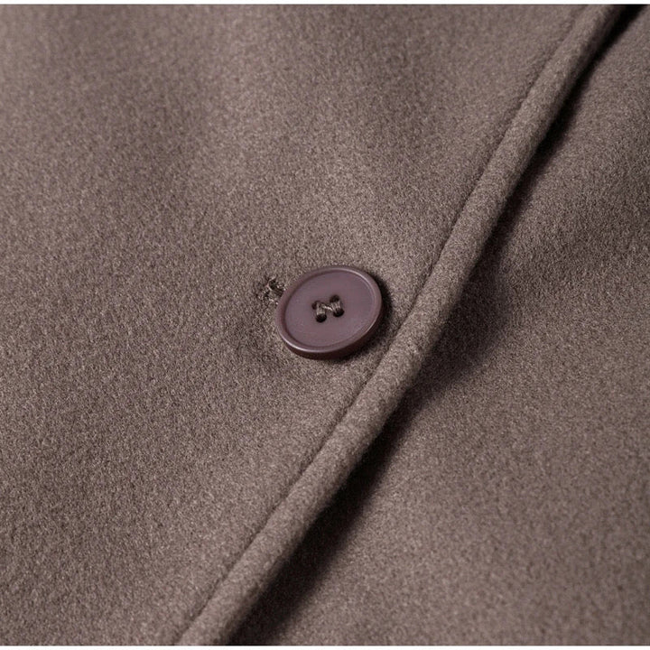 Women's coat with double-breasted button placket and oversized cut