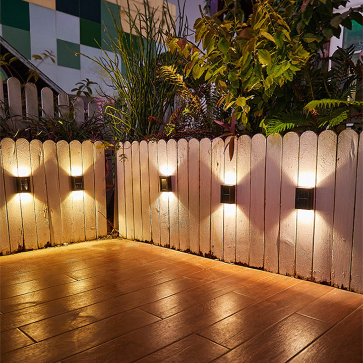Solar-powered LED wall light for garden and path lighting