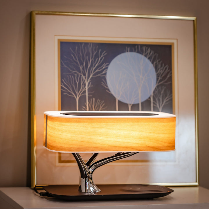Designer LED table lamp with wood look, Bluetooth speaker and wireless charging function