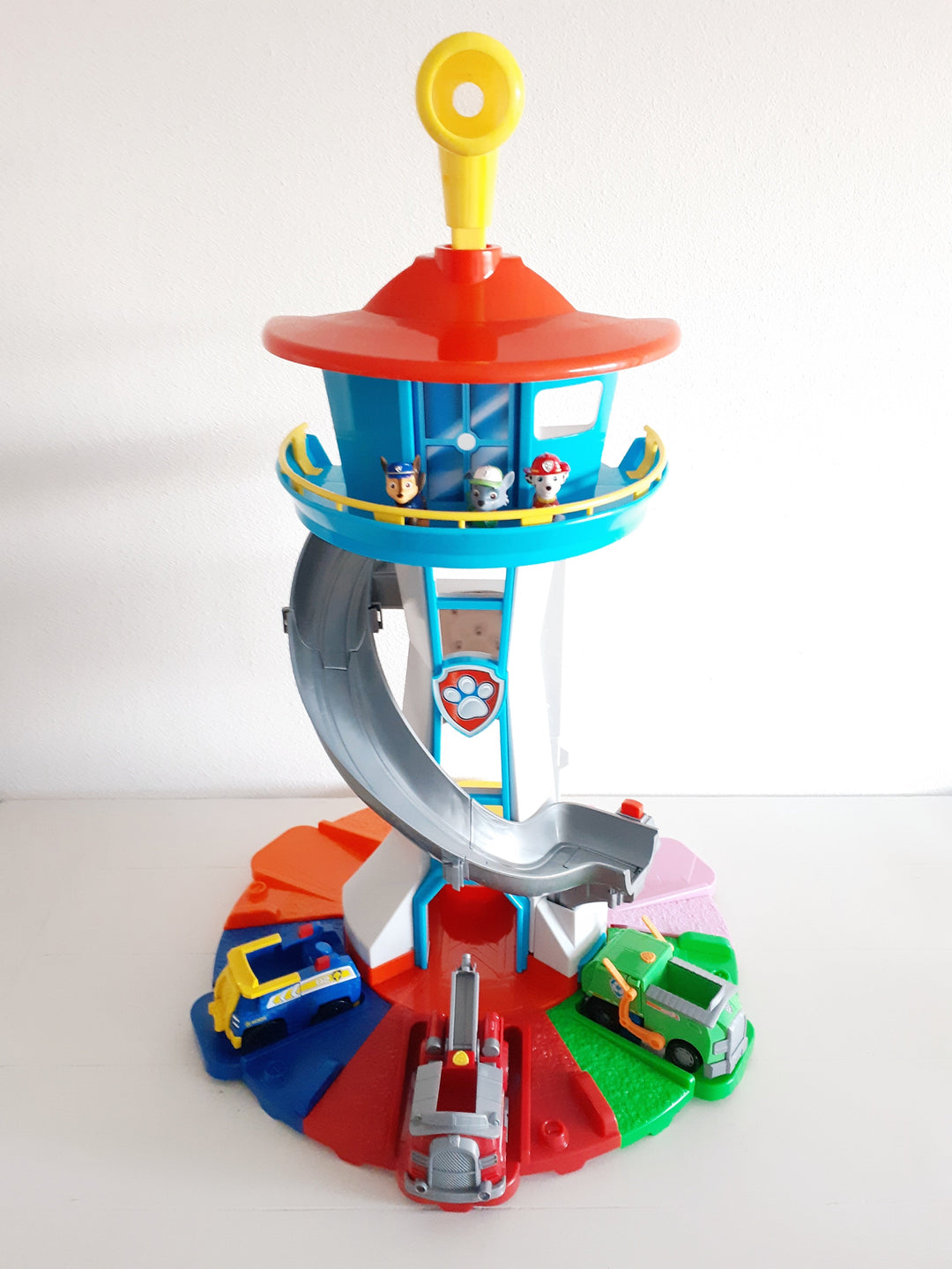 Adventure play tower with slide and race track