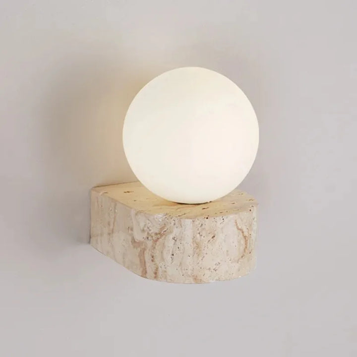 LED wall light with stone base and globe glass for stylish interiors