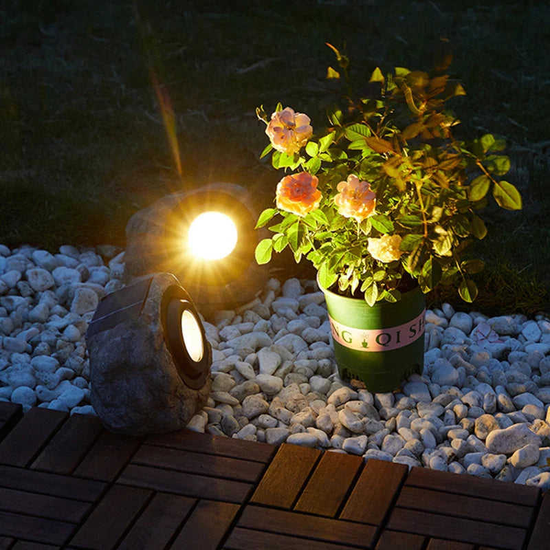 Solar-powered LED path light in natural stone design