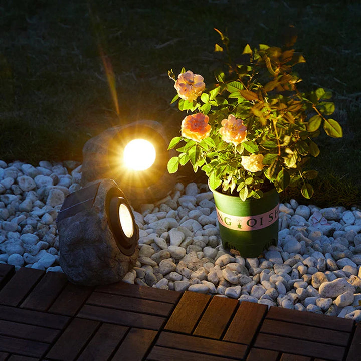 Solar-powered LED path light in natural stone design