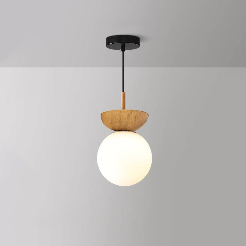 Ceiling light with glass globe and wood look in Japanese-Nordic style