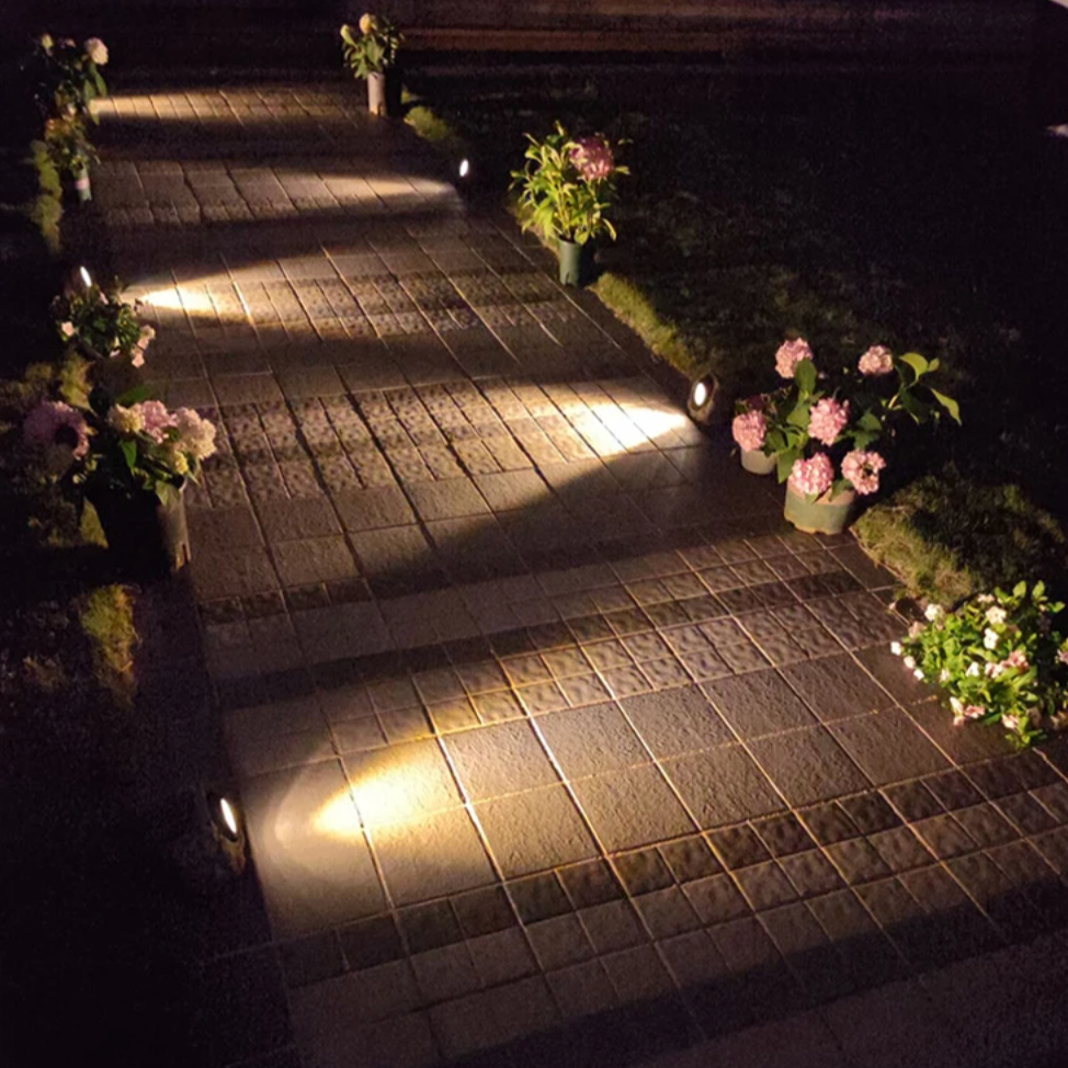 Solar-powered LED path light in natural stone design