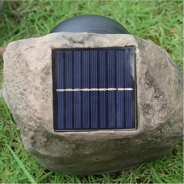 Solar-powered LED path light in natural stone design