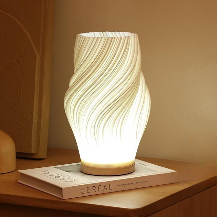 Seitliche Ansicht der LED-Tischlampe mit elegantem Wellen-Design