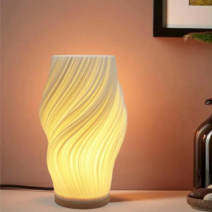 Moderne Design-Tischlampe mit geschwungener LED-Lichtform aus Kunststoff