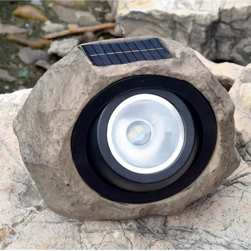 Solar-powered LED path light in natural stone design