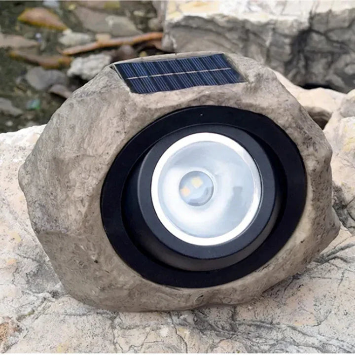 Solar-powered LED path light in natural stone design
