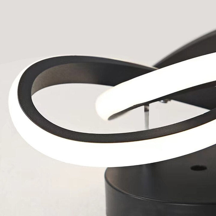 Modern LED ceiling light with three rings in a sculptural design