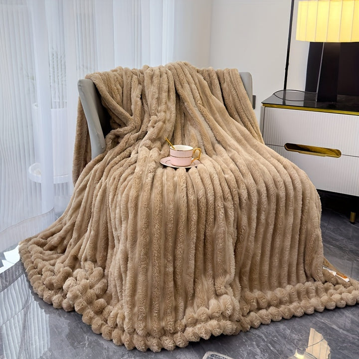 Sofa blanket with plush look