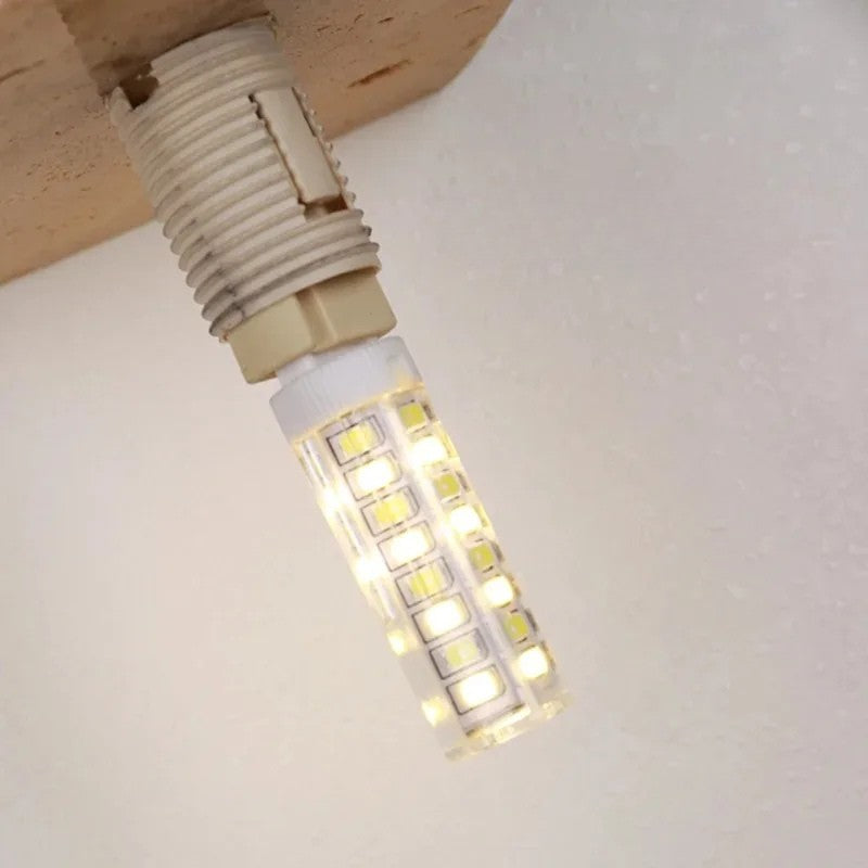 LED wall light with stone base and globe glass for stylish interiors