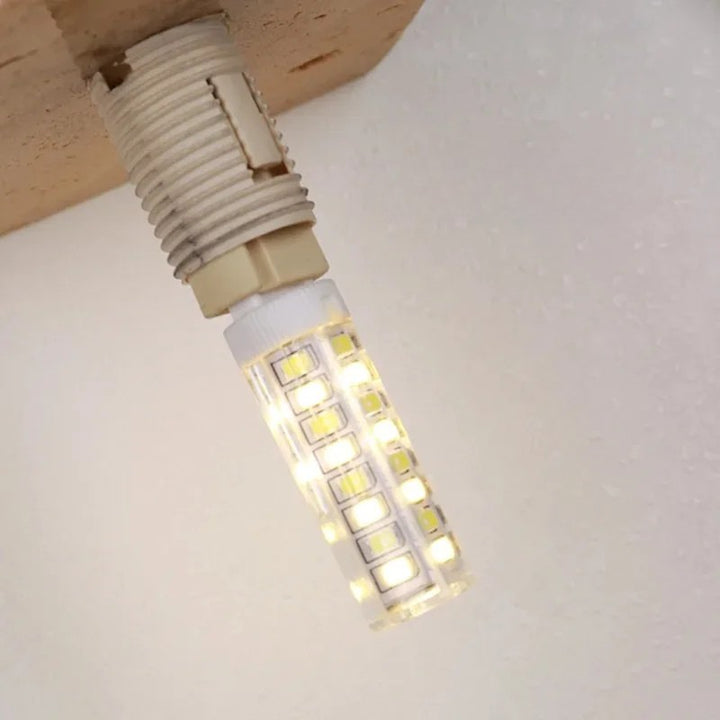 LED wall light with stone base and globe glass for stylish interiors