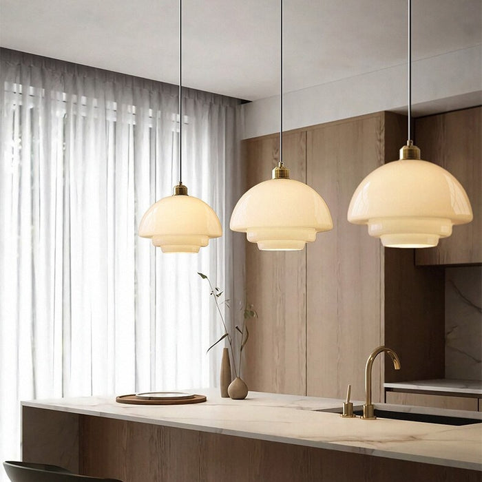 Mid-century style pendant lamp made of frosted glass with brass detail