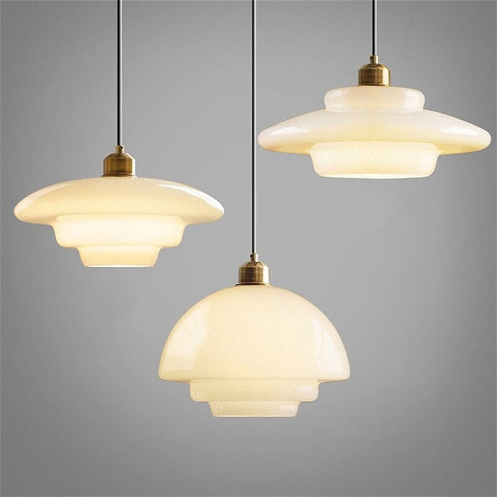 Mid-century style pendant lamp made of frosted glass with brass detail