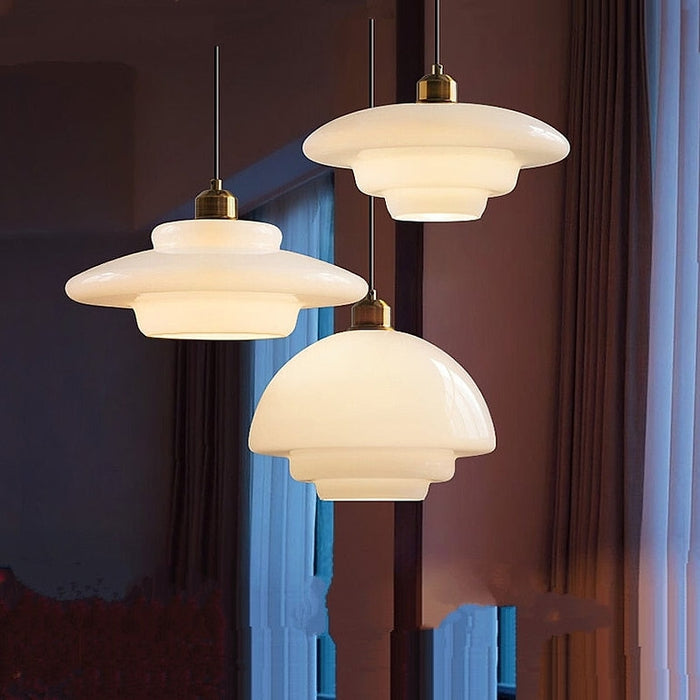 Mid-century style pendant lamp made of frosted glass with brass detail
