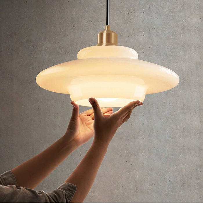 Mid-century style pendant lamp made of frosted glass with brass detail