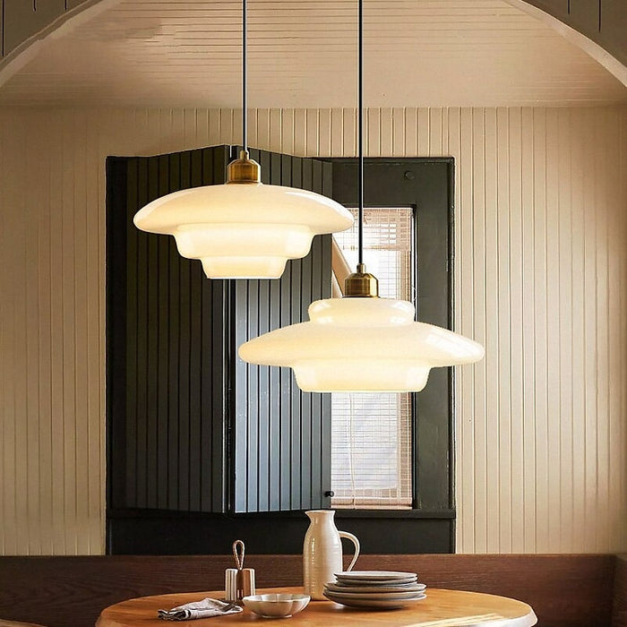 Mid-century style pendant lamp made of frosted glass with brass detail