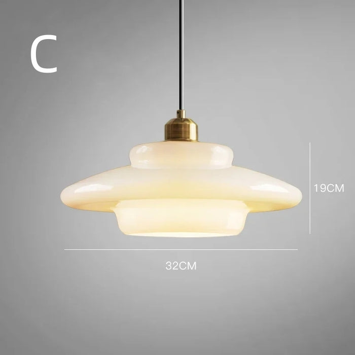 Mid-century style pendant lamp made of frosted glass with brass detail