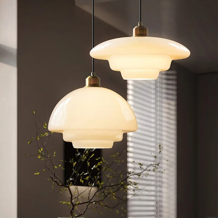 Mid-century style pendant lamp made of frosted glass with brass detail