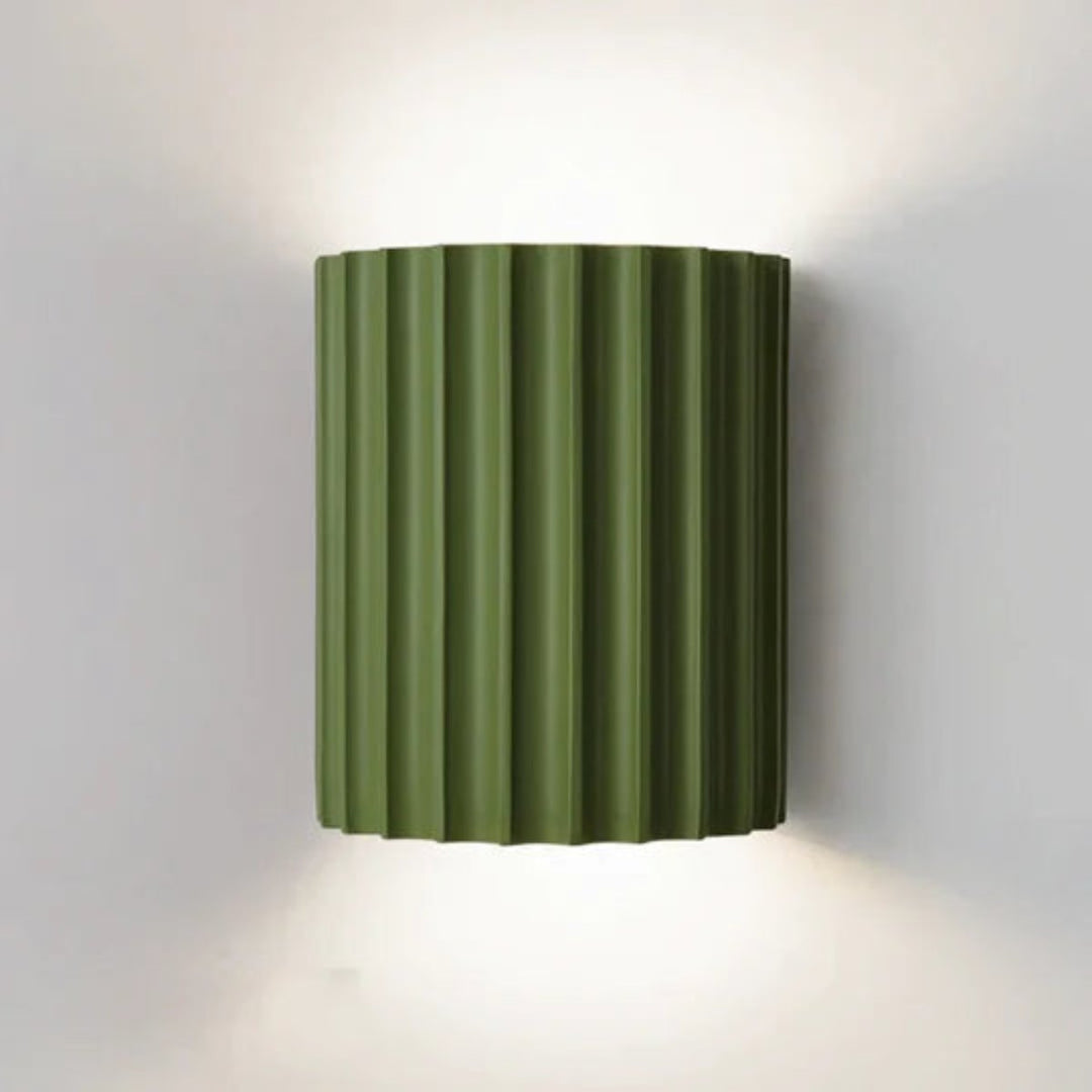 Modern LED wall light in a ribbed cylindrical shape for indoor use
