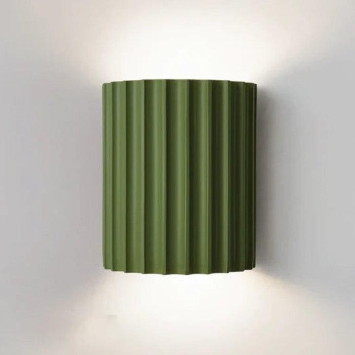 Modern LED wall light in a ribbed cylindrical shape for indoor use
