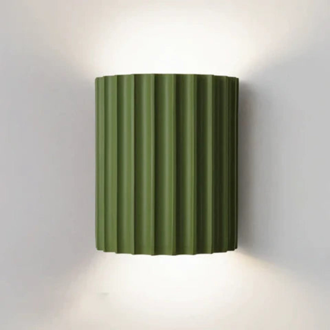 Modern LED wall light in a ribbed cylindrical shape for indoor use