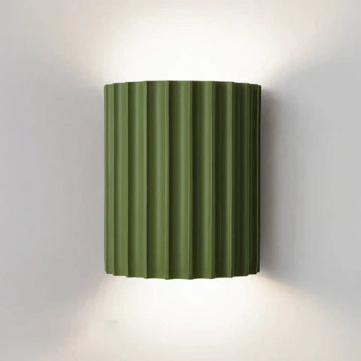 Modern LED wall light in a ribbed cylindrical shape for indoor use