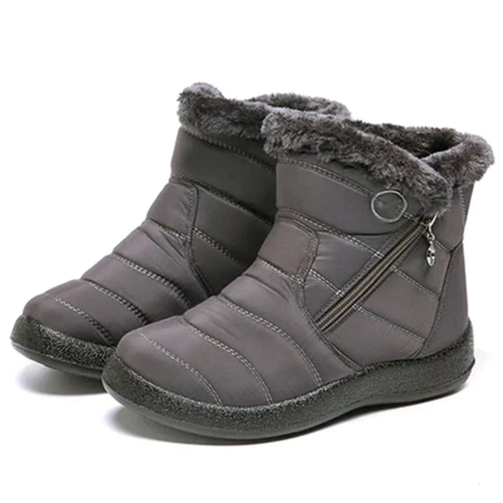 Women's ankle boots with quilted design and zipper