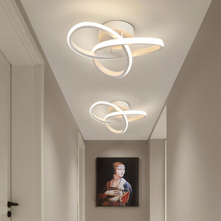 Modern LED ceiling light with three rings in a sculptural design