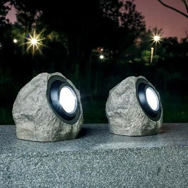 Solar-powered LED outdoor lamp with stone look for garden