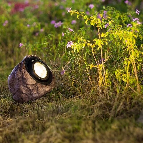 Solar-powered LED outdoor lamp with stone look for garden