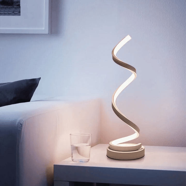Spiral table lamp with warm light for modern living spaces