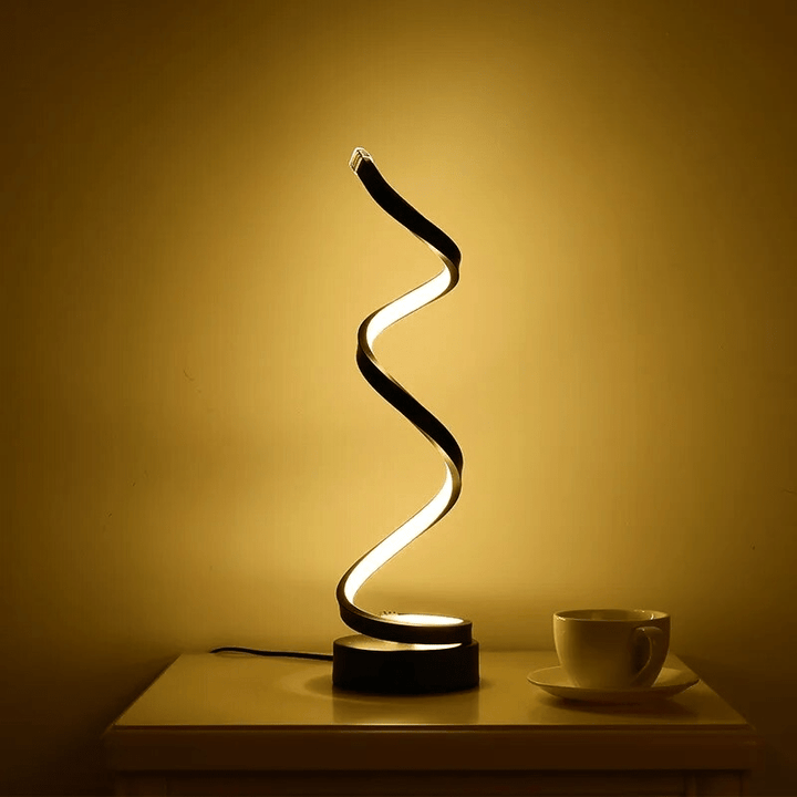 Spiral table lamp with warm light for modern living spaces
