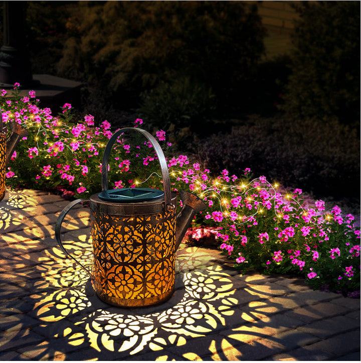 Solar-powered watering can light with LED light cascade for the garden