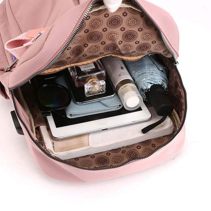 Water-repellent USB backpack with anti-theft protection and compartment system